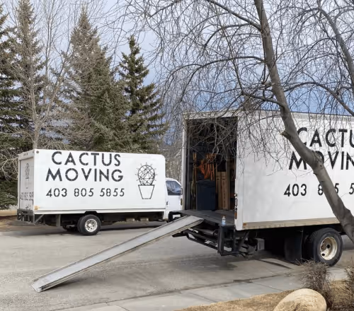 Two Cactus Moving trucks being loaded