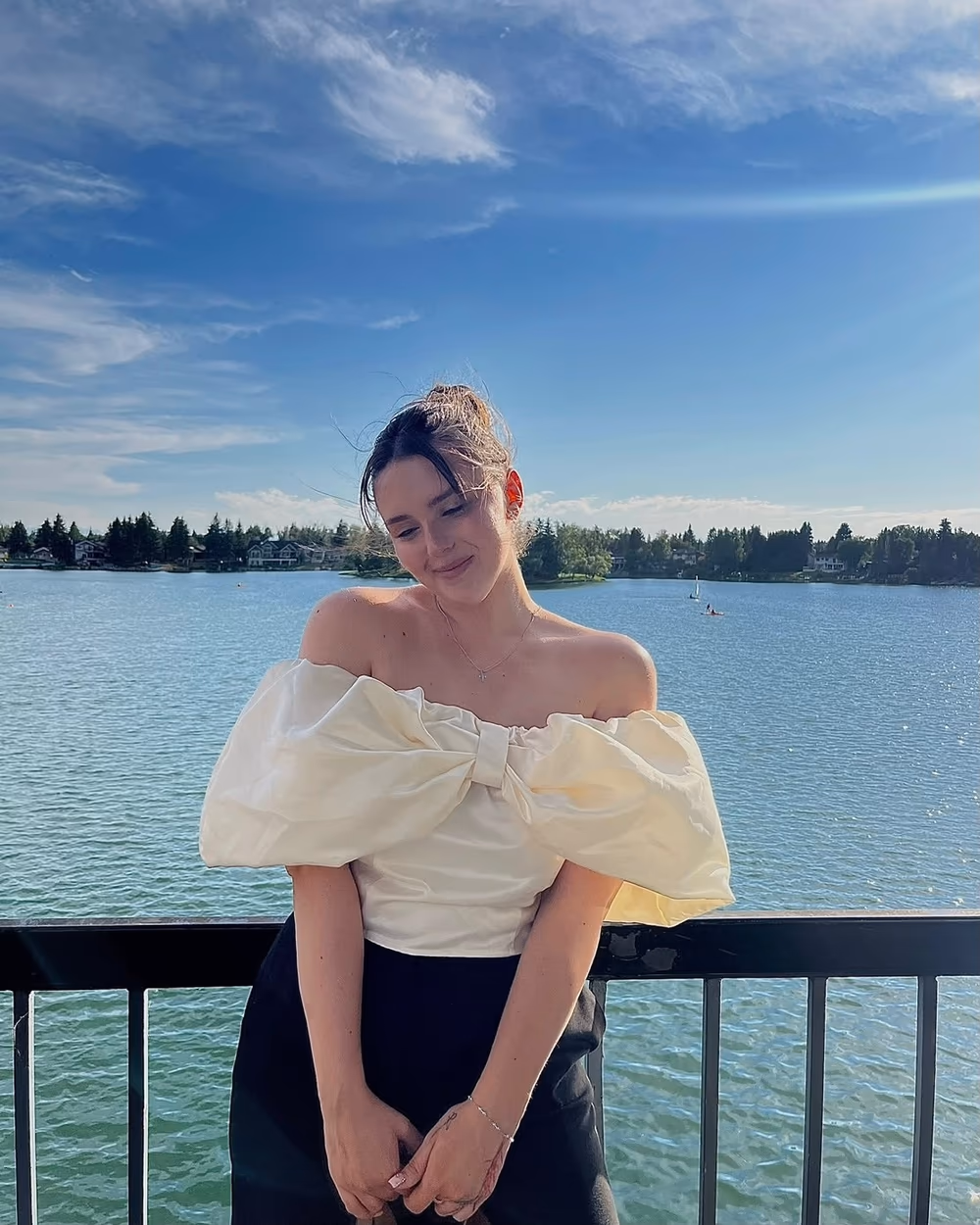 Mariya Gulchenko by a lake on a sunny day